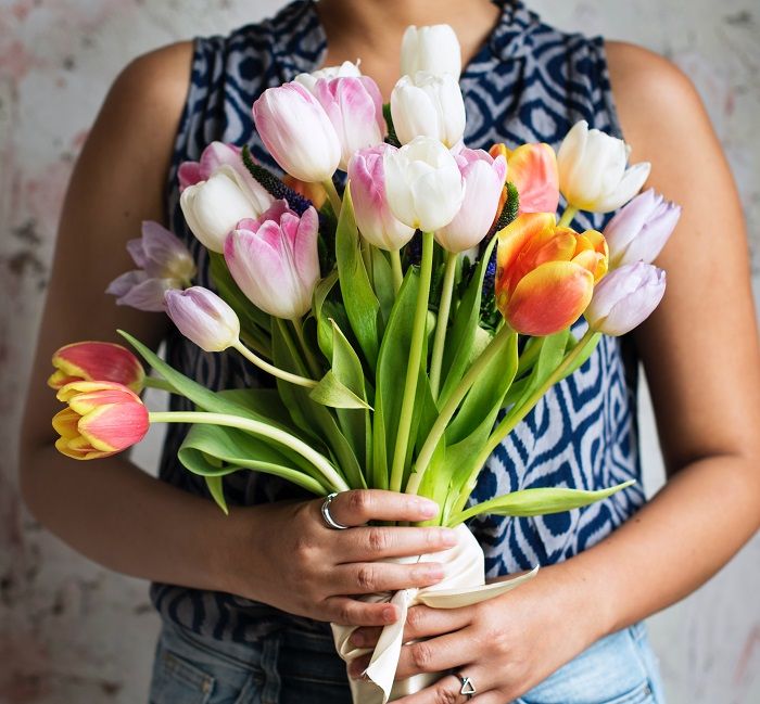 Woman holding a bunch of flowers